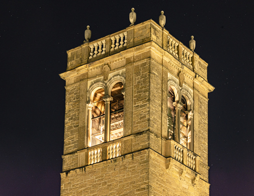 Photo of Carillon Bell Tower outside of the UW-Madison Social Science Building at night.